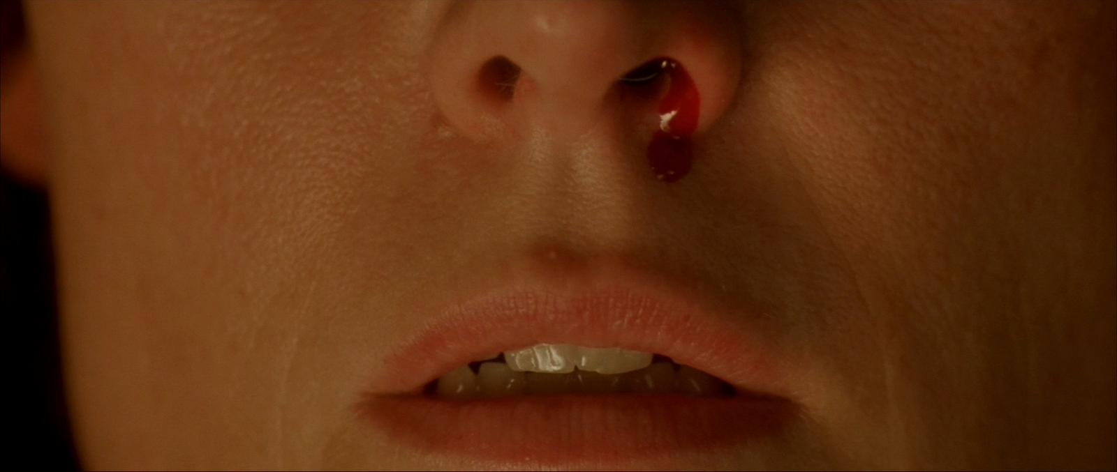 a close up of a person with a nose piercing