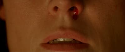 a close up of a person with a nose piercing