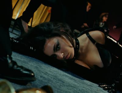 a woman laying on the ground with her head down