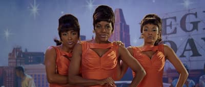 a group of women standing next to each other