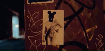 a picture of a person wearing a mask on a wall