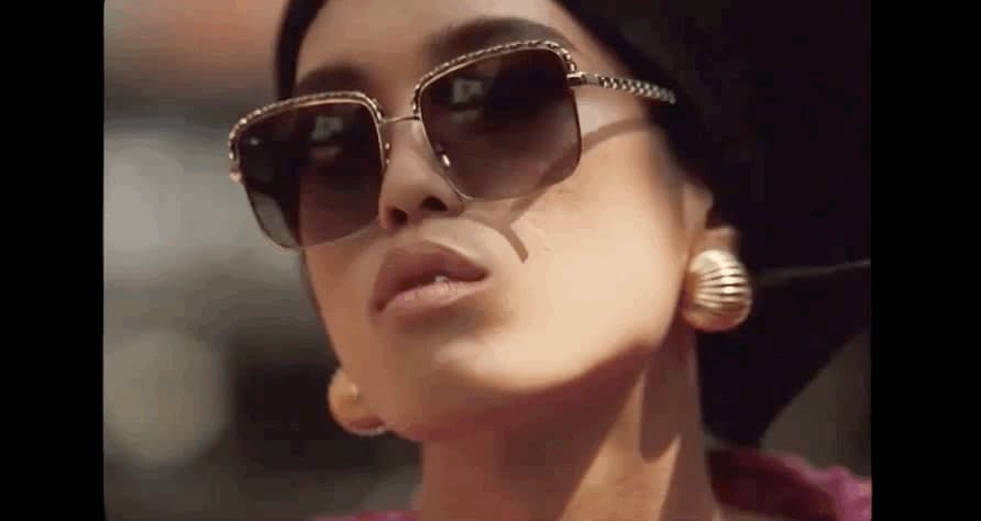 a close up of a person wearing sunglasses and a hat