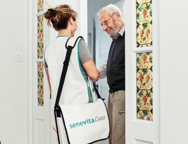 a man and woman standing in front of a doorway