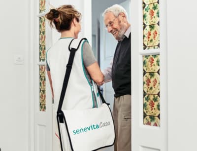 a man and woman standing in front of a doorway