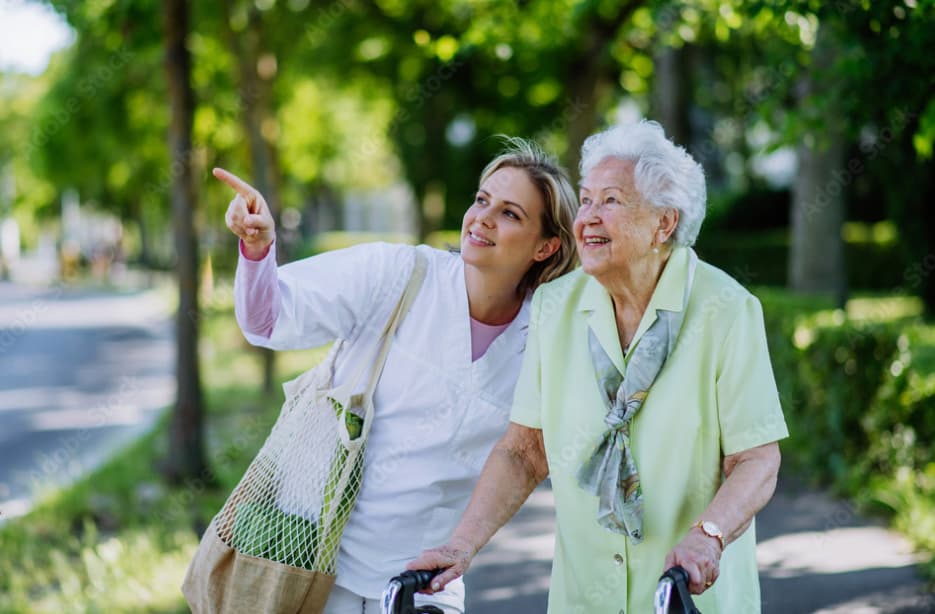 an older woman and a younger woman on bicycles