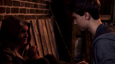 a man and a woman sitting next to each other