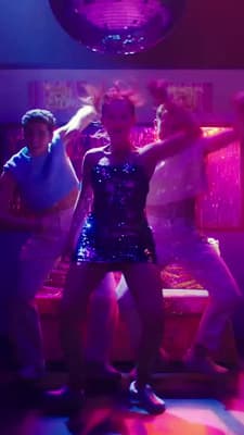 a group of people dancing in a room