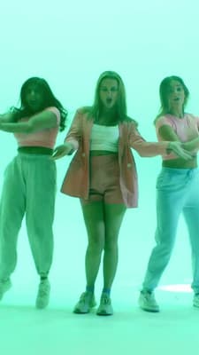 a group of young women standing next to each other