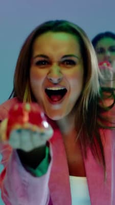 a woman with a fake toothbrush in her hand
