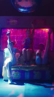 a group of people sitting on top of a table