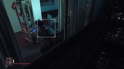 a person sitting in a room at night