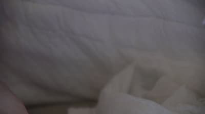 a blurry photo of a person's hand holding a cell phone