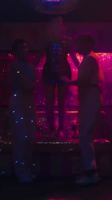 a group of people standing around in a room