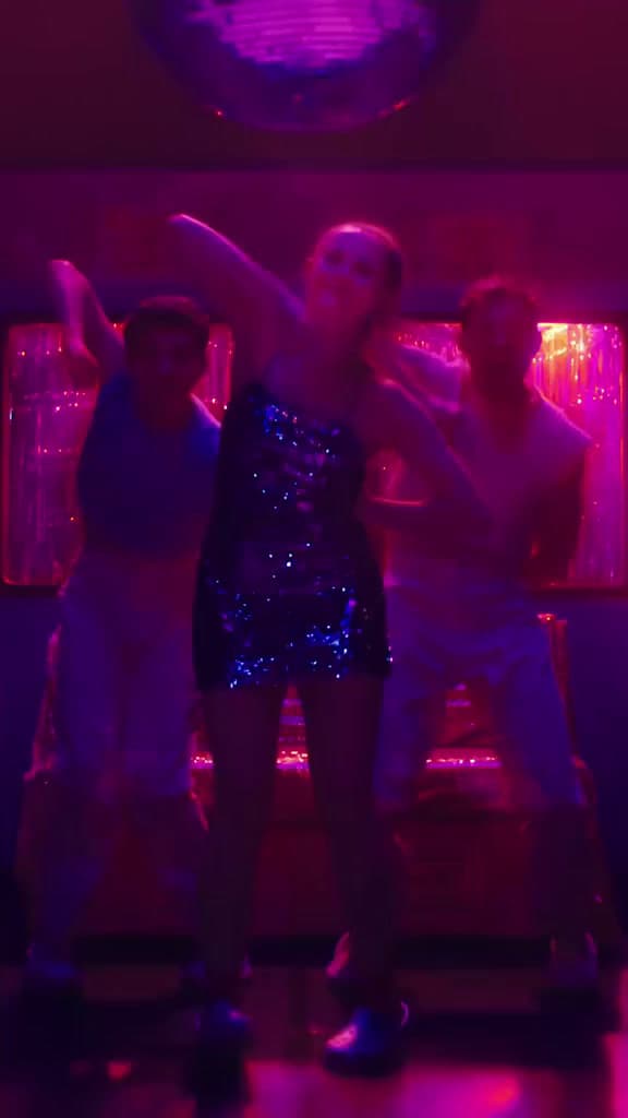 a couple of people that are dancing in a room