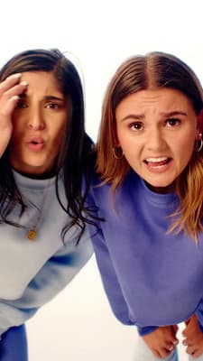 two young women are posing for a picture