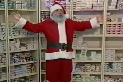 a man dressed as santa claus in a store