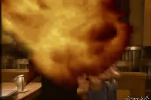 a blurry picture of a person in a kitchen
