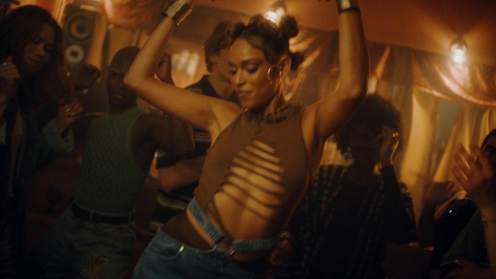 a group of people dancing at a party