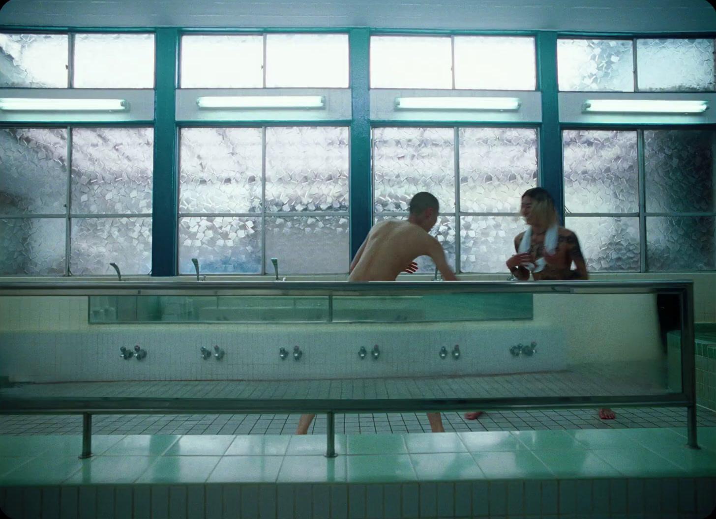 a couple of people that are in a bath room