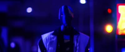 a mannequin wearing a white shirt and black scarf
