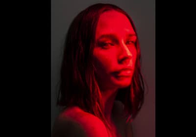 a woman with red light on her face