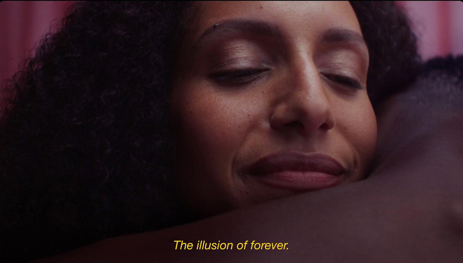 a close up of a person hugging a person