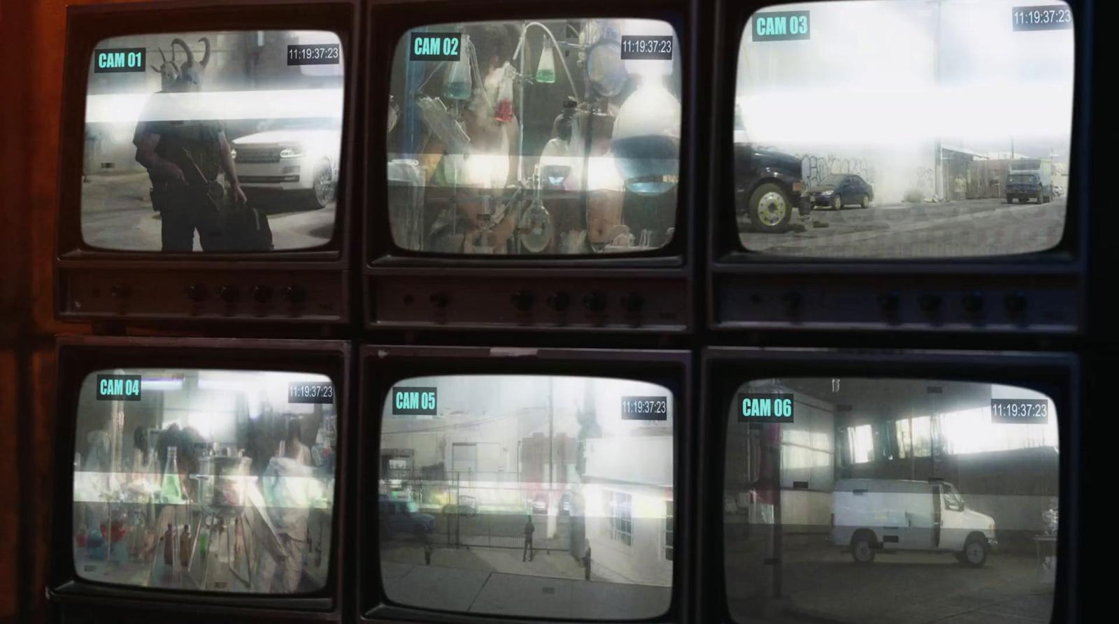 a bunch of tvs that are sitting on a wall
