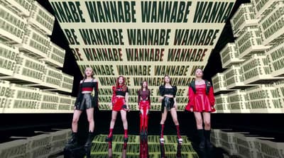 a group of young women standing next to each other