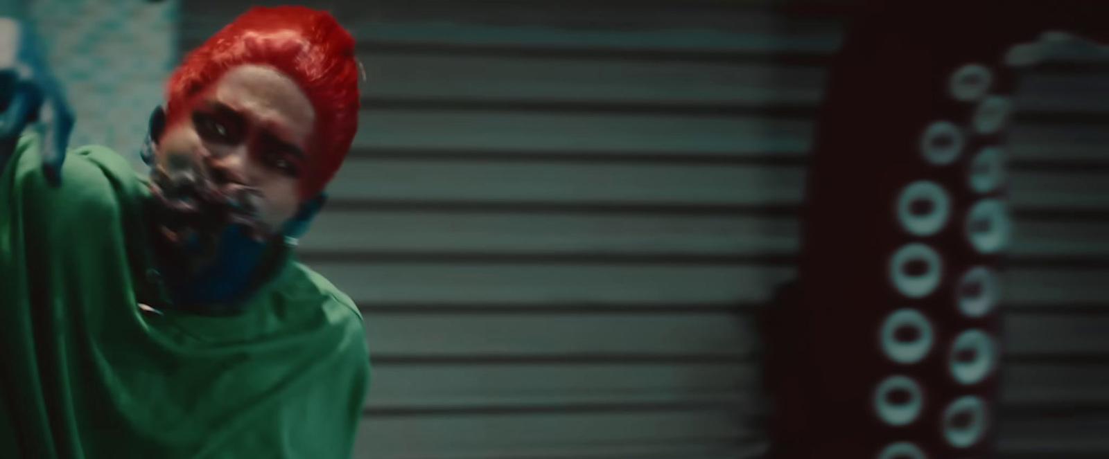 a man with red hair and a green shirt