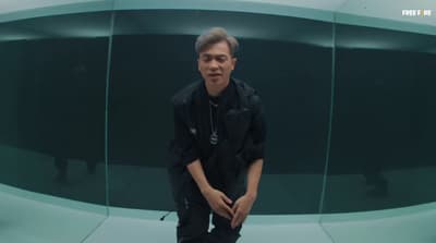 a man standing in front of a glass wall