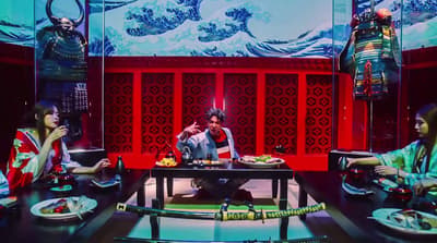 a group of people sitting around a table