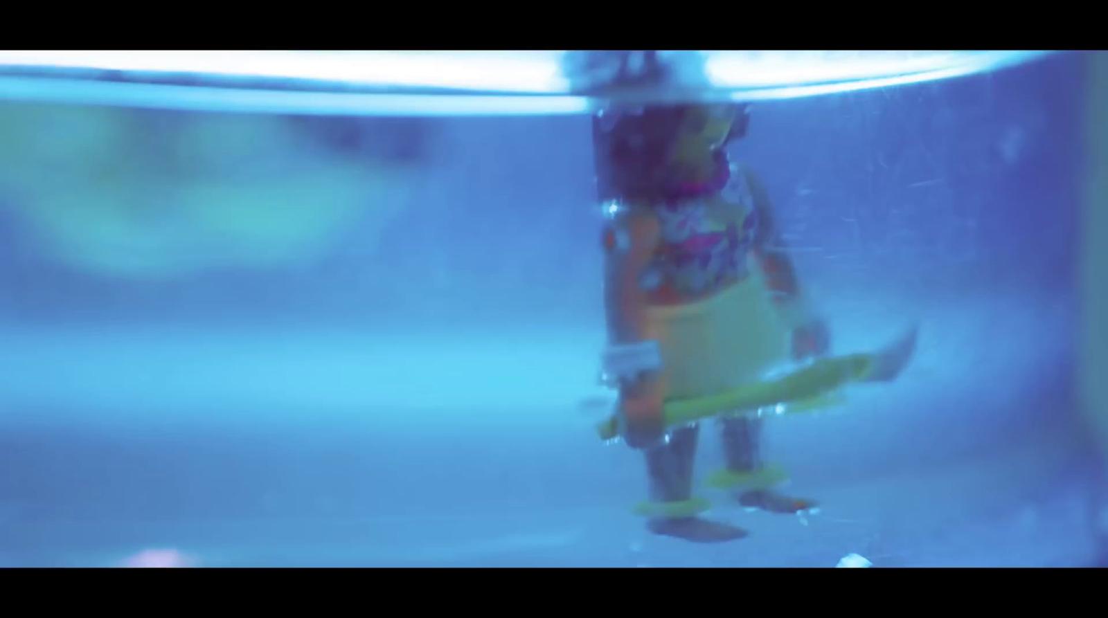 a toy figure is floating in the water