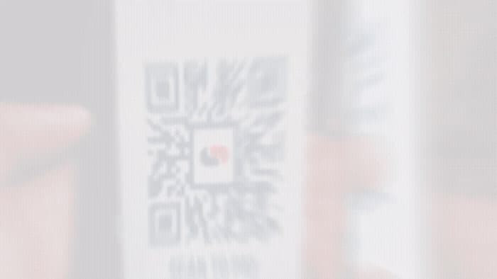 a blurry photo of a person holding a cell phone