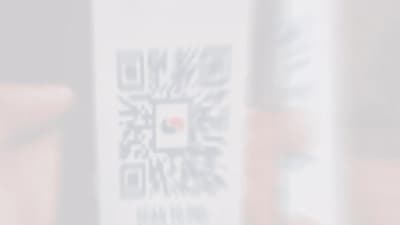 a blurry photo of a person holding a cell phone