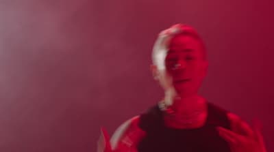 a man holding a nintendo wii game controller