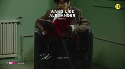 a man sitting in a chair reading a book