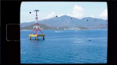 a large body of water with a crane in the middle of it