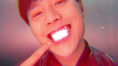 a man with a toothbrush in his mouth