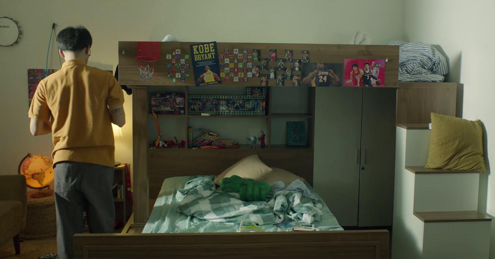a man standing in front of a bunk bed