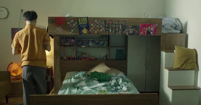a man standing in front of a bunk bed