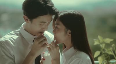 a man and a woman standing next to each other