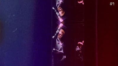 a group of men standing on top of a stage