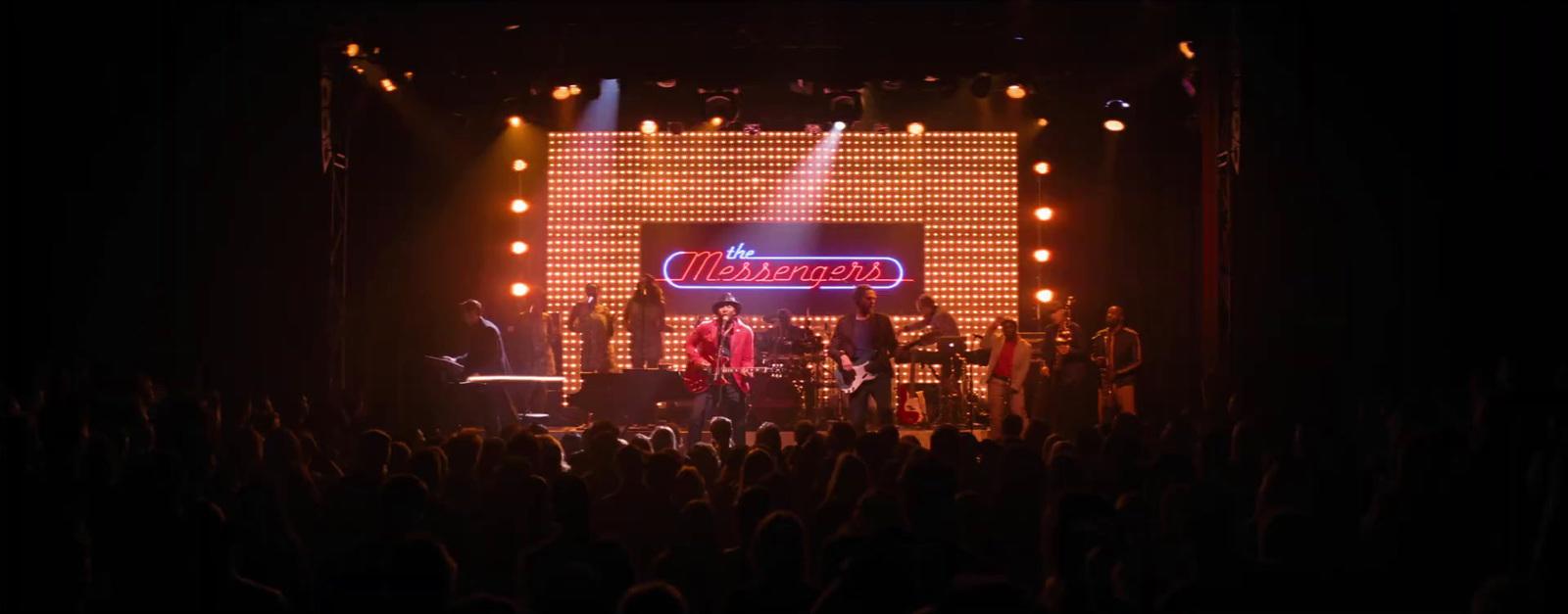 a group of people standing on top of a stage