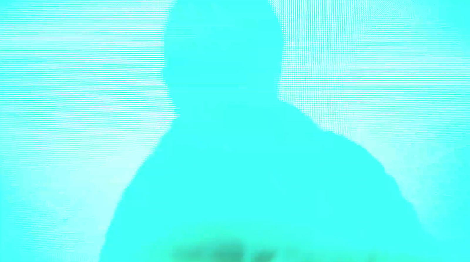 a blurry image of a man in a suit and tie