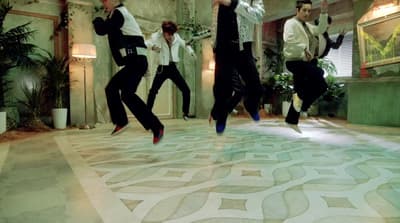 a group of men jumping in the air