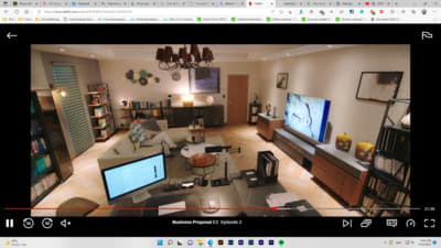 a living room with a large flat screen tv