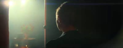a blurry photo of a person in a dark room