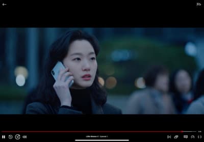 a woman is talking on a cell phone