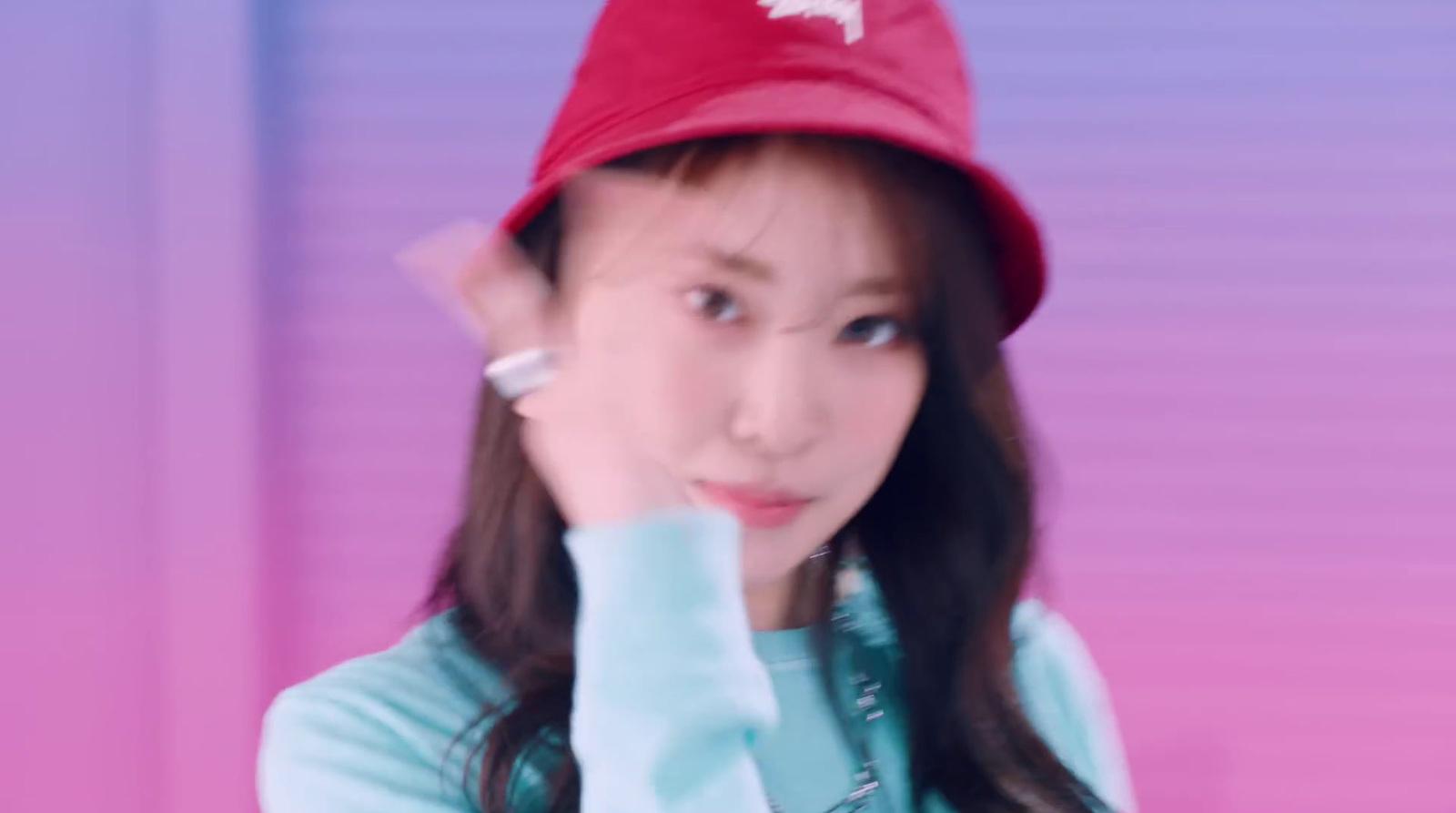 a woman wearing a red hat and blue shirt