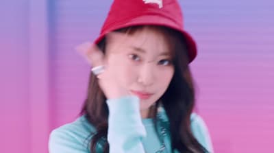 a woman wearing a red hat and blue shirt